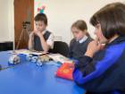 Pupils working with robot reading companions